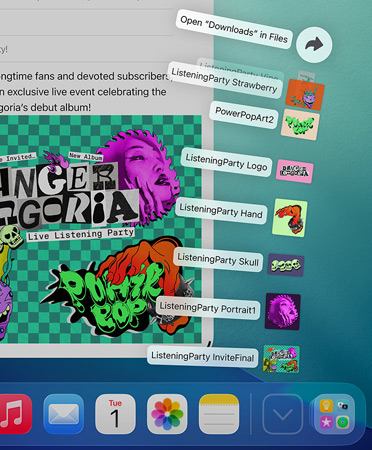 Close-up of Dock across bottom of screen with a series of files fanning out vertically from the Dock